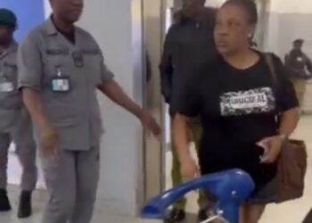 “Netizens Outraged as Woman Tears Husband’s Passport at Lagos Airport; Immigration Launches Investigation”